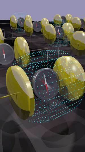A conceptual illustration of magnetization reversal, given by the compasses, with an electric field (blue) applied across the gold capacitors.